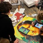 Children finishing a large Brick Mosaic of Leonardo Da Vinci's Mona Lisa